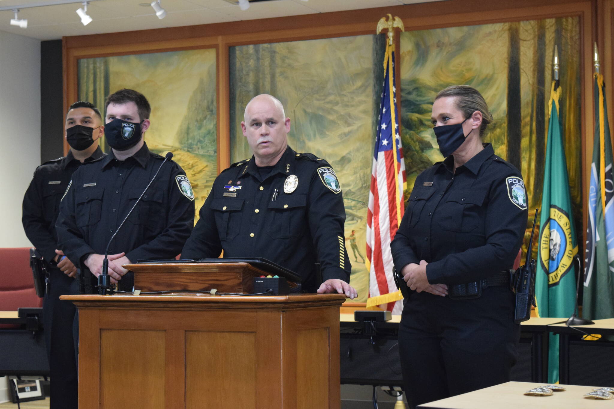 James Aquirre (middle left) being sworn in by Police Chief Perry Phipps (middle right) at a city council meeting on Aug. 9, 2021. File photo by Conor Wilson/Valley Record