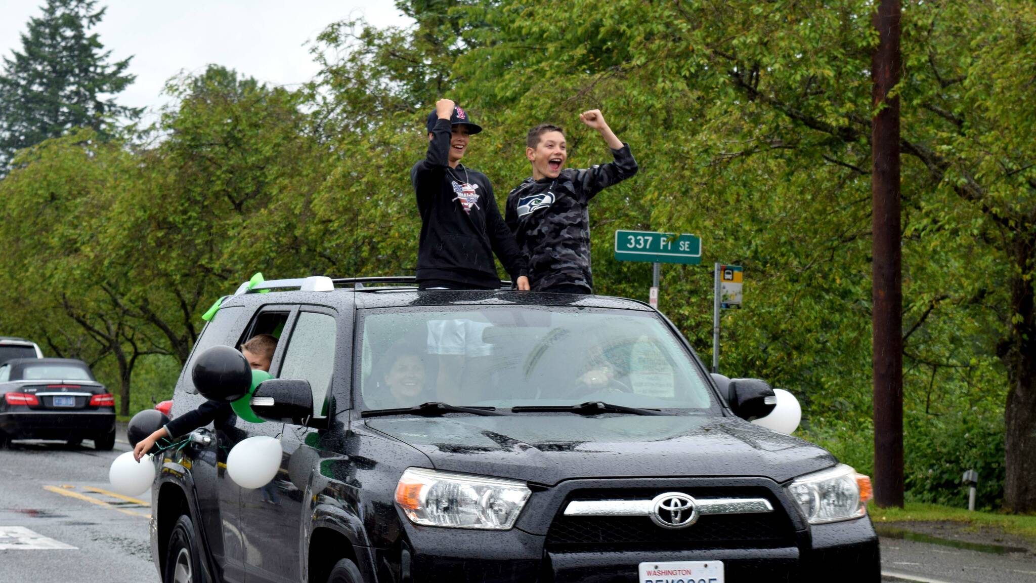 Two boys celebrate during the Fall City Graduate Parade on June 17. The annual parade recognizes 5th, 8th and 12th grade graduates. All photos by Conor Wilson/Valley Record.