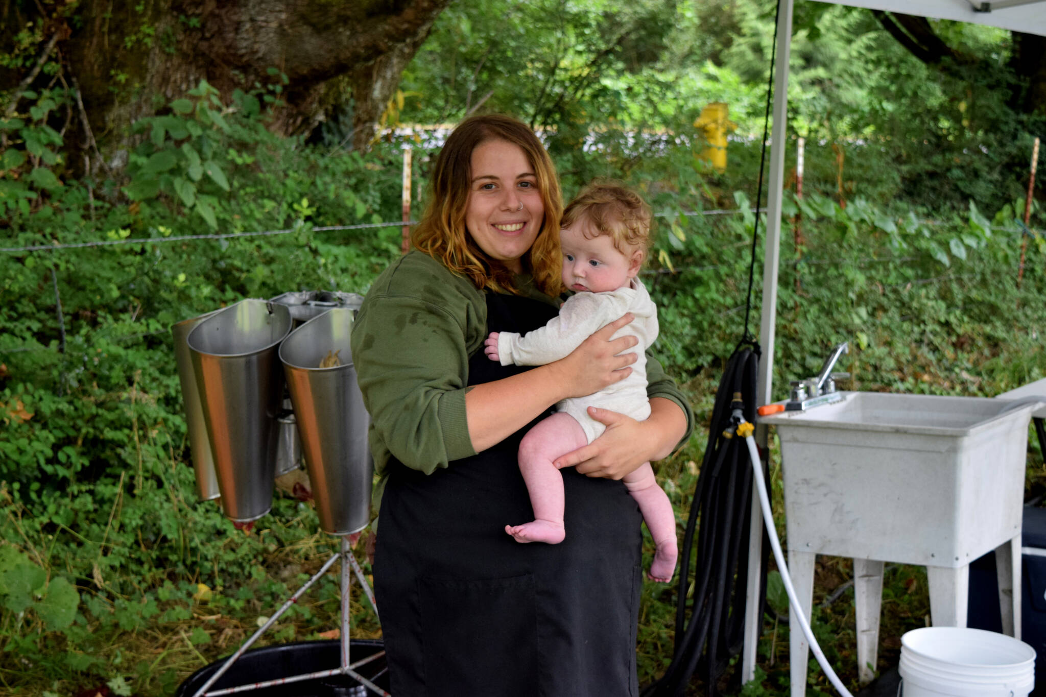 Conor Wilson / Valley Record 
Lulu Redder, owner of Feral Woman Farms in North Bend, and her daughter Rosie.