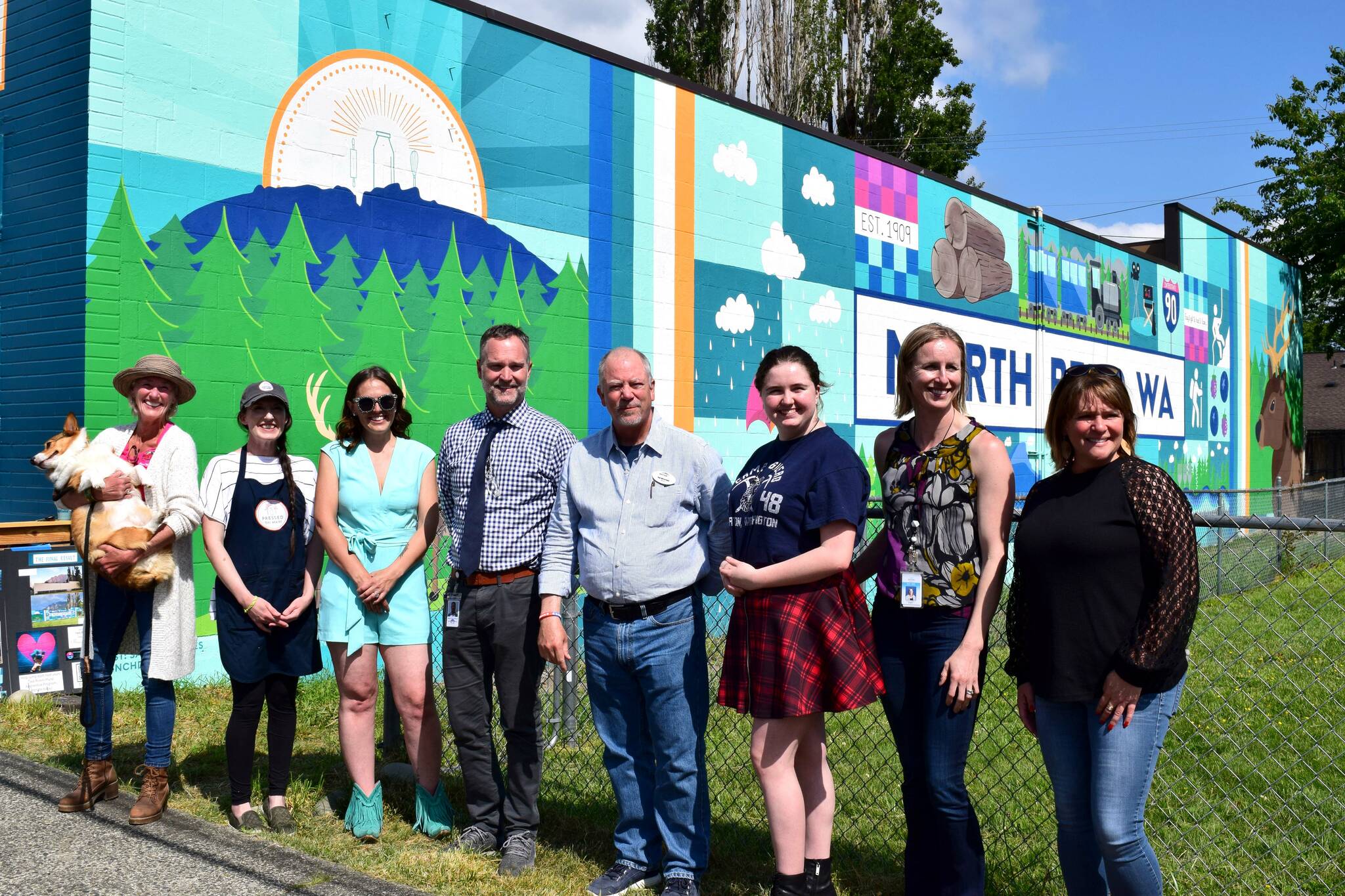 From left: North Bend Councilmember Mary Miller, Pressed on Main owner Hayley Raff, Artist Sarah Hugues, SVSD Superintendent Dan Schlotfeldt, North Bend Mayor Rob McFarland, Two Rivers student Ava Mulligan, Two River Principal Catherine Fredenburg, and Two Rivers Internship Coordinator Chrissy Riley. Photo Conor Wilson/Valley Record.