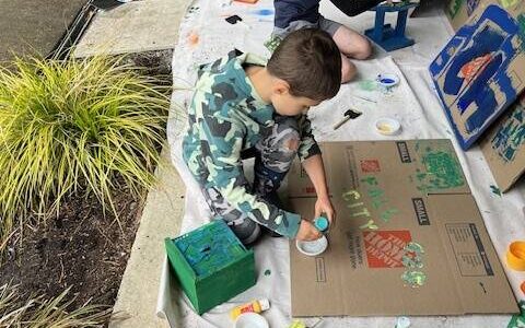 Troop 425 Scouts painting bird houses and feeders for the Fall City Art Park. (Photo courtesy of Kyle Sundet)