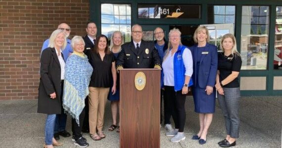 Police Chief Brian Lynch with Snoqualmie and North Bend officials at the June 24 opening of a police substation at North Bend Outlet Mall. (Photo by Mallory Kruml/Valley Record)