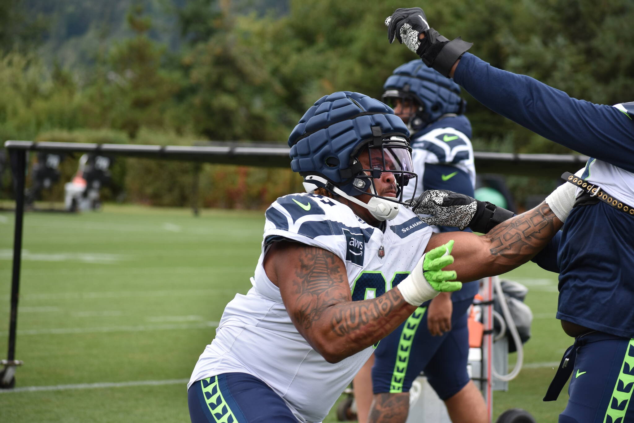 Byron Murphy II gets going during a defensive line drill. Photos by Ben Ray / Sound Publishing