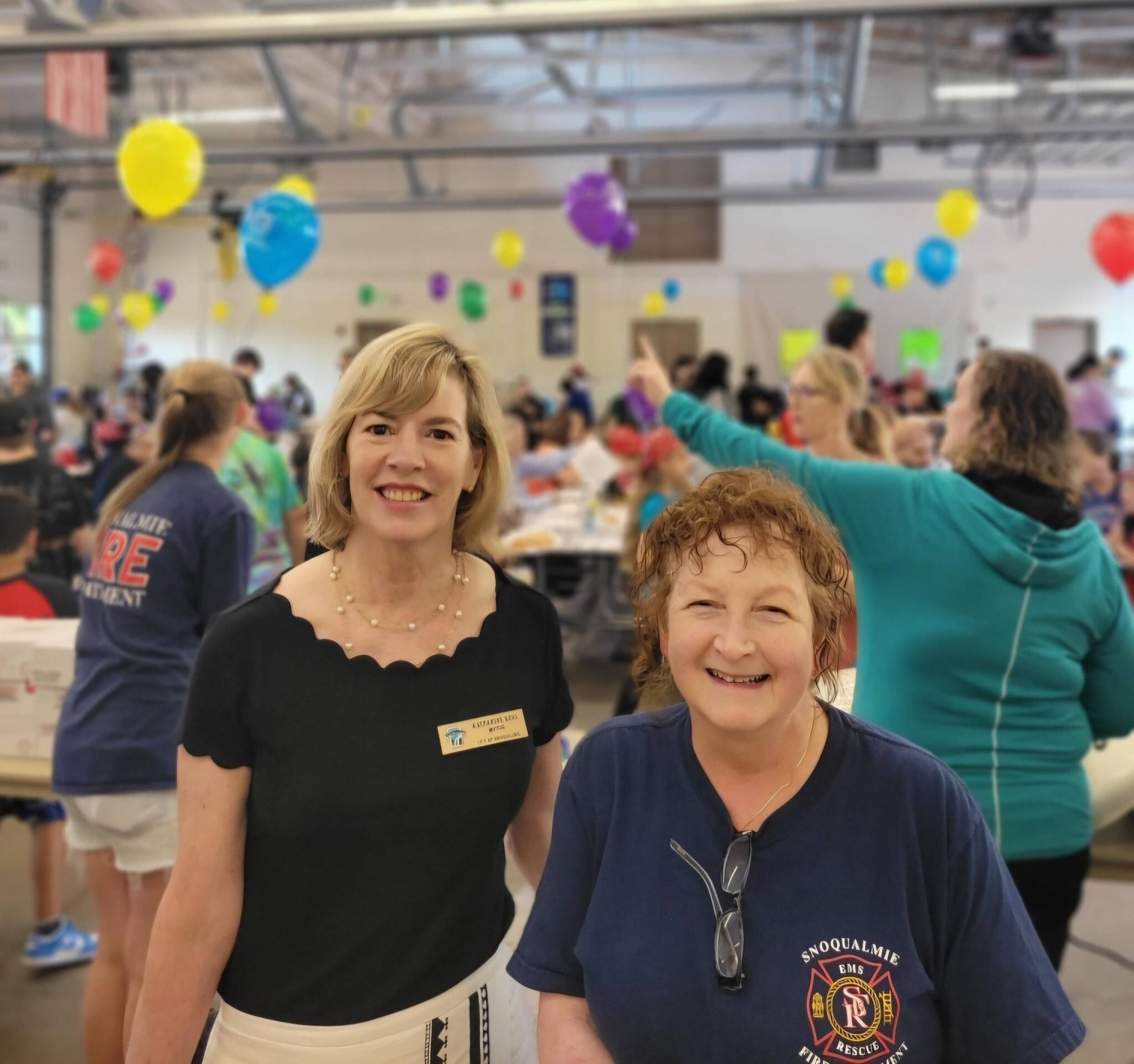 Snoqualmie Mayor Katherine Ross (left) and Snoqualmie City Councilmember Kat Cotton at the annual Firefighters Pancake Breakfast on Aug. 17. Photo courtesy of the Snoqualmie Fire Department