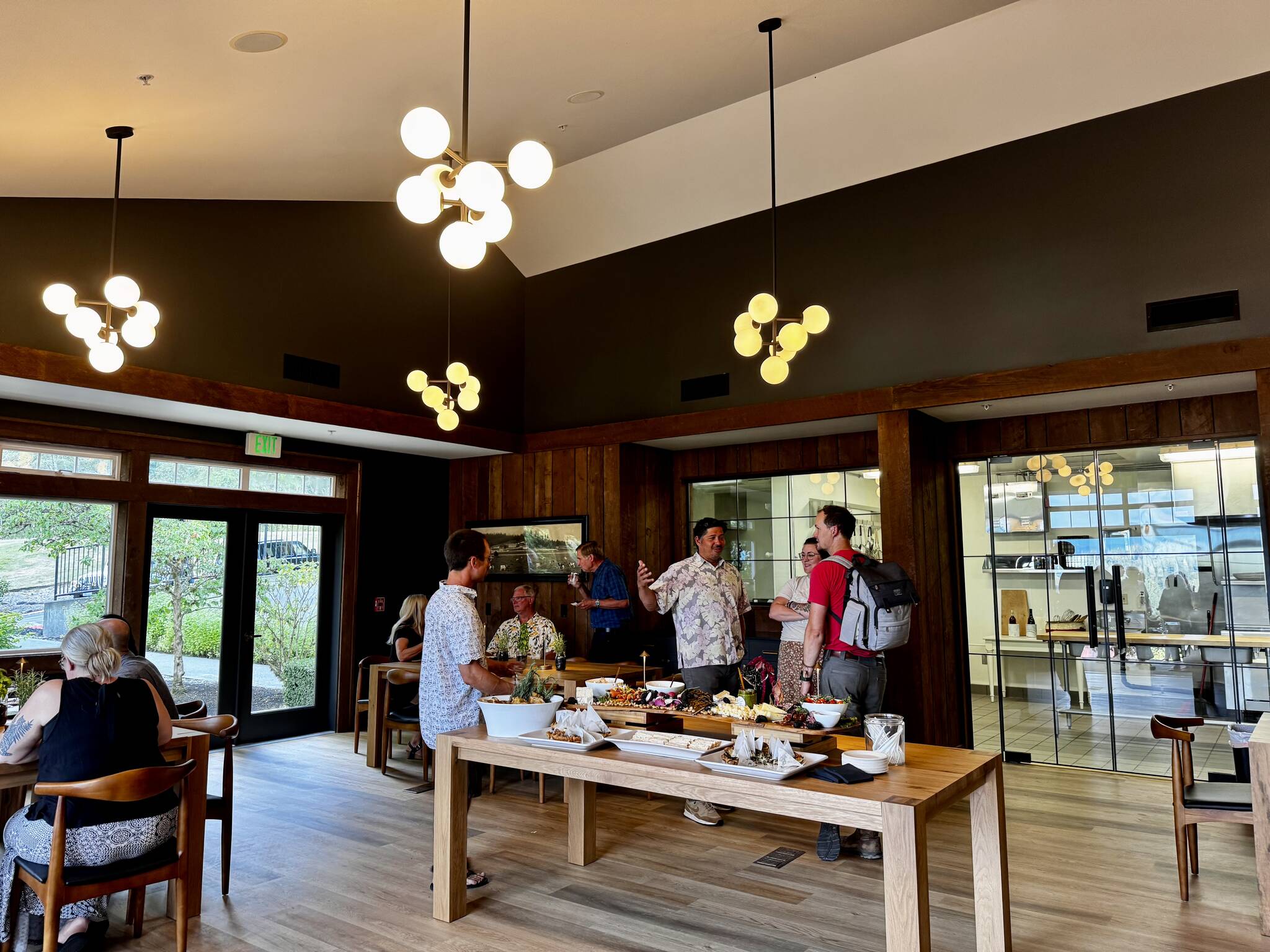 Carnation Farms staff members gather with their family and friends at the Farmview Kitchen’s soft opening Aug. 14, 2024. Photo by Grace Gorenflo/For the Valley Record