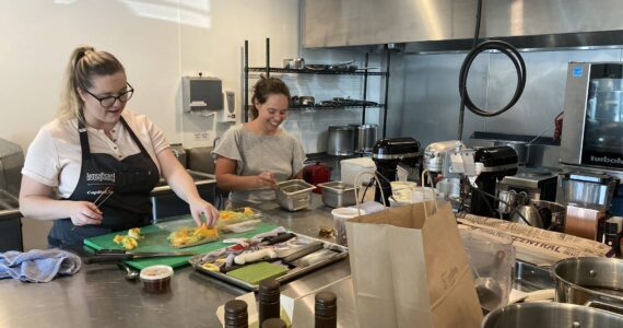 A few of the collective’s renters utilizing the commercial kitchen space. (Photo by Mallory Kruml/Valley Record)