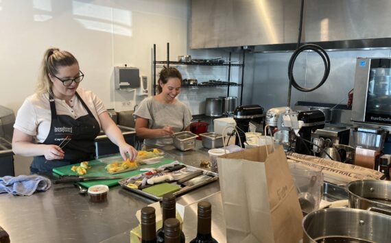 A few of the collective’s renters utilizing the commercial kitchen space. (Photo by Mallory Kruml/Valley Record)