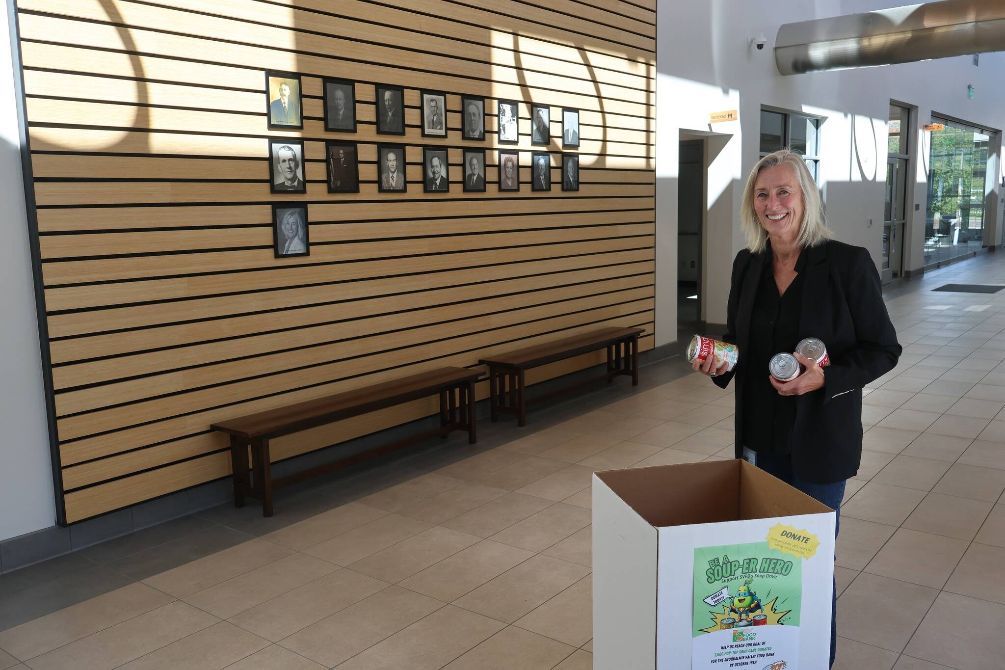 North Bend Mayor Mary Miller dropping off soup cans at the city hall collection bin. Courtesy photo