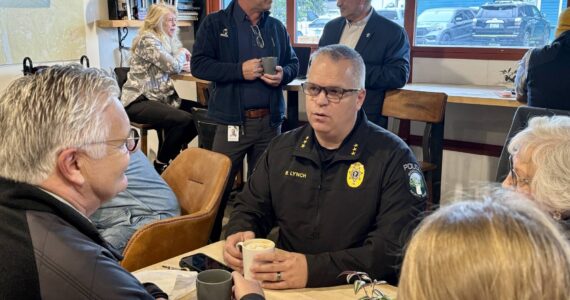 Photos courtesy of the city of North Bend
Snoqualmie Police Chief Brian Lynch speaks with community members at a Sept. 17 “Chat with the Chief” event at Arete Coffee Bar in North Bend.