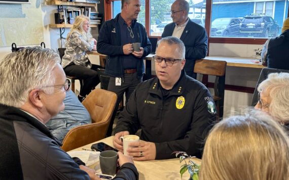 Photos courtesy of the city of North Bend
Snoqualmie Police Chief Brian Lynch speaks with community members at a Sept. 17 “Chat with the Chief” event at Arete Coffee Bar in North Bend.