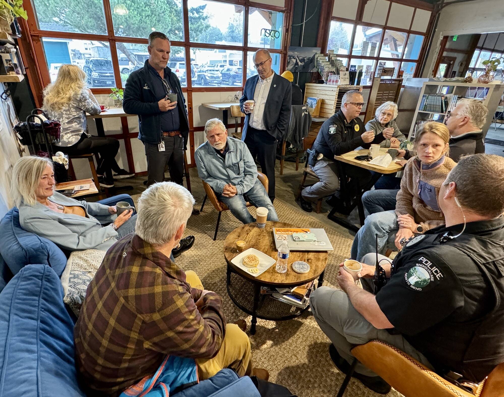 Photos courtesy of the city of North Bend
Snoqualmie Police Chief Brian Lynch speaks with community members at a Sept. 17 “Chat with the Chief” event at Arete Coffee Bar in North Bend.