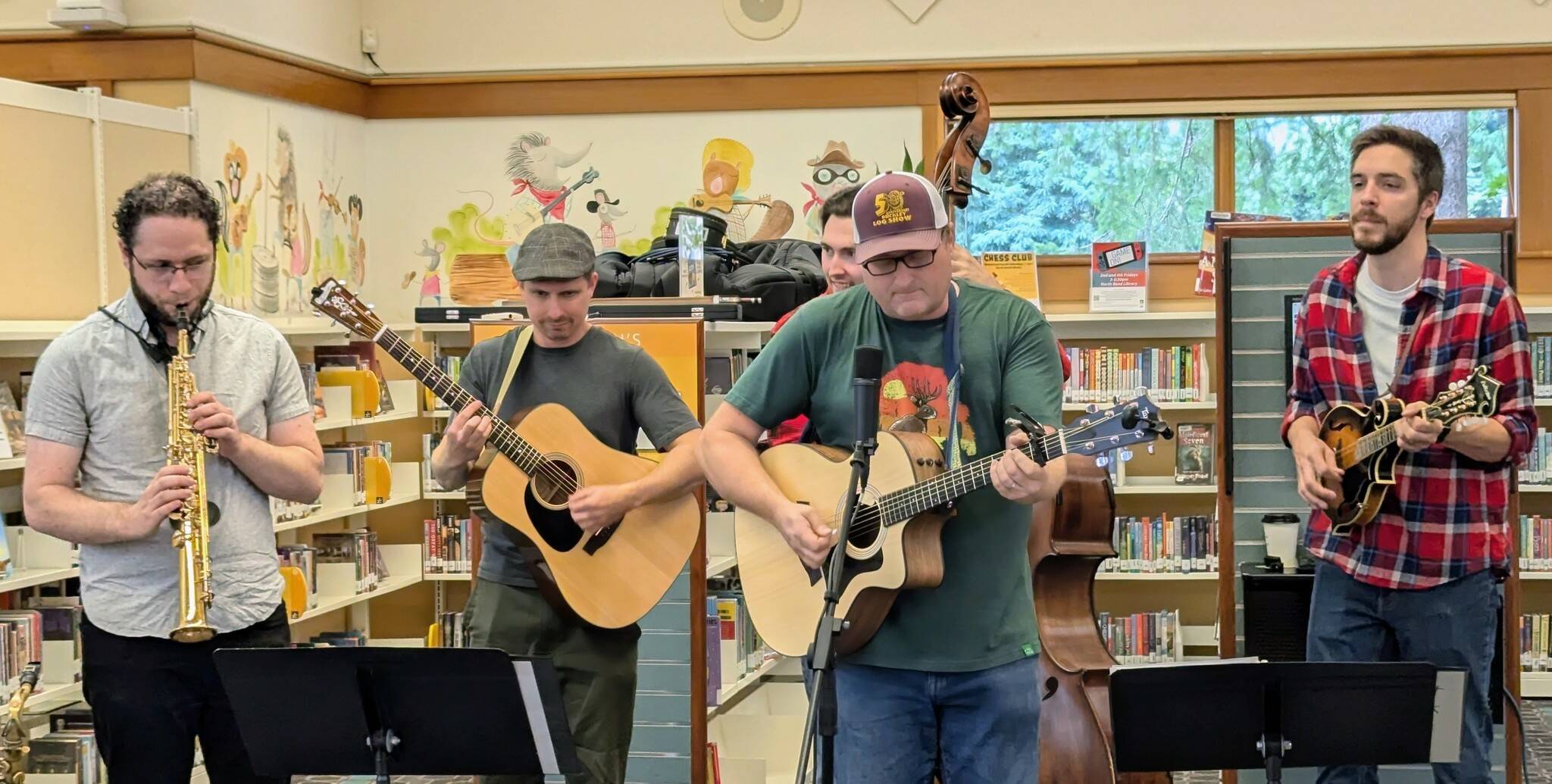 The North Bend Library celebrated its 30th anniversary on Sept. 14 from 11 a.m. to 4 p.m. with cake, cherry pie and coffee from Trail Youth Coffee. Tinkham Road, 425 Magazine’s “favorite local band,” also performed at the event. (Photo courtesy of the North Bend Library)