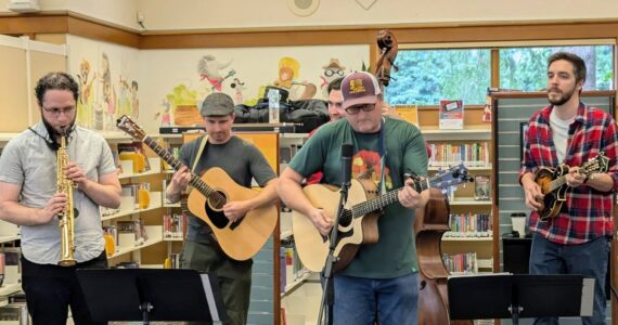 The North Bend Library celebrated its 30th anniversary on Sept. 14 from 11 a.m. to 4 p.m. with cake, cherry pie and coffee from Trail Youth Coffee. Tinkham Road, 425 Magazine’s “favorite local band,” also performed at the event. (Photo courtesy of the North Bend Library)