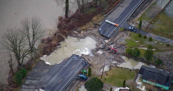 Crews assess the damage to State Route 202 during the 2009 Snoqualmie River flood. Photo courtesy of King County Department of Natural Resources.