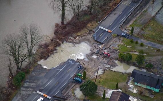 Crews assess the damage to State Route 202 during the 2009 Snoqualmie River flood. Photo courtesy of King County Department of Natural Resources.