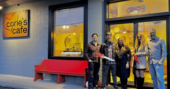 Owner of Corie’s Cafe Corie Goodloe stands for a photo with friends and family at the opening of her new restaurant, Nov. 22, 2024. (Grace Gorenflo/Valley Record)