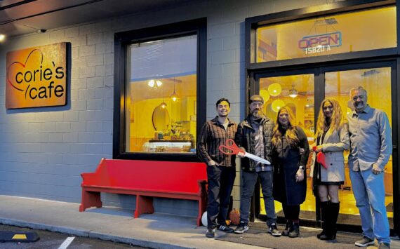 Owner of Corie’s Cafe Corie Goodloe stands for a photo with friends and family at the opening of her new restaurant, Nov. 22, 2024. (Grace Gorenflo/Valley Record)