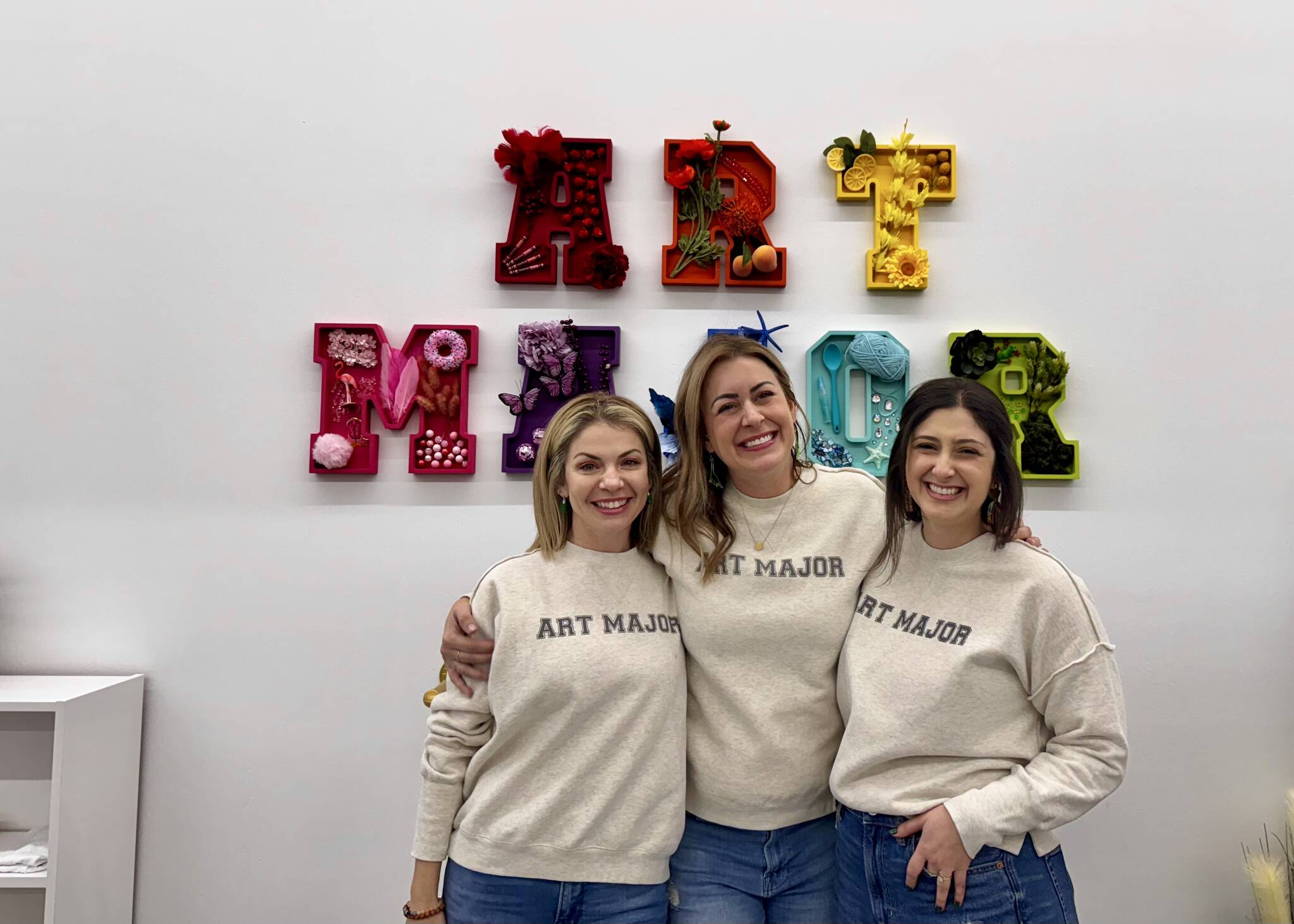 Anne Williams, owner of the Snoqualmie Art Major Studios location, stands for a photo at her grand opening Dec. 5, 2024, with Art Major Studios founder Allie Kingsley Baker (left) and owner of the Art Major Studios Colorado location McKenna Aslin (right). (Grace Gorenflo/Valley Record)