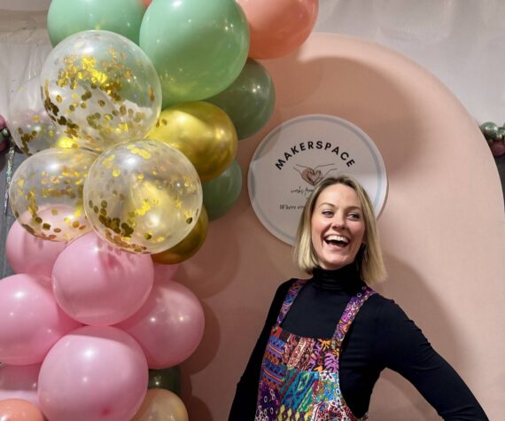 Ashley James stands for a photo at the grand opening of her new makerspace, Works from the heART, Dec. 7, 2024. (Grace Gorenflo/Valley Record)