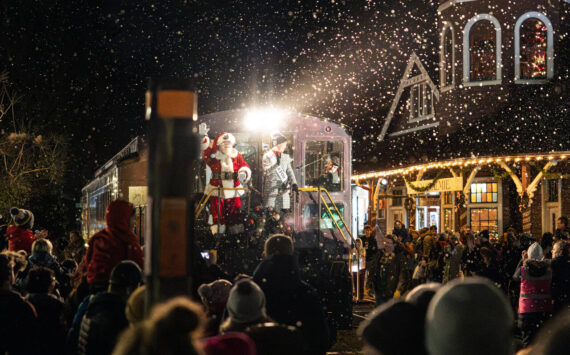 Mayor Katherine Ross arrives with Santa Claus during the Snoqualmie Winter Lights celebration on December 7, 2024, in Snoqualmie, Washington. (Photo by Henry Rodenburg)