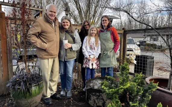 The family of Maggi Whitaker stands for a photo with Down to Earth’s new bird bath. From left: Bill Whitaker Alice Friedel, Ann Marie Whitaker, Violet Friedel and Jenny Whitaker. (Grace Gorenflo/Valley Record)